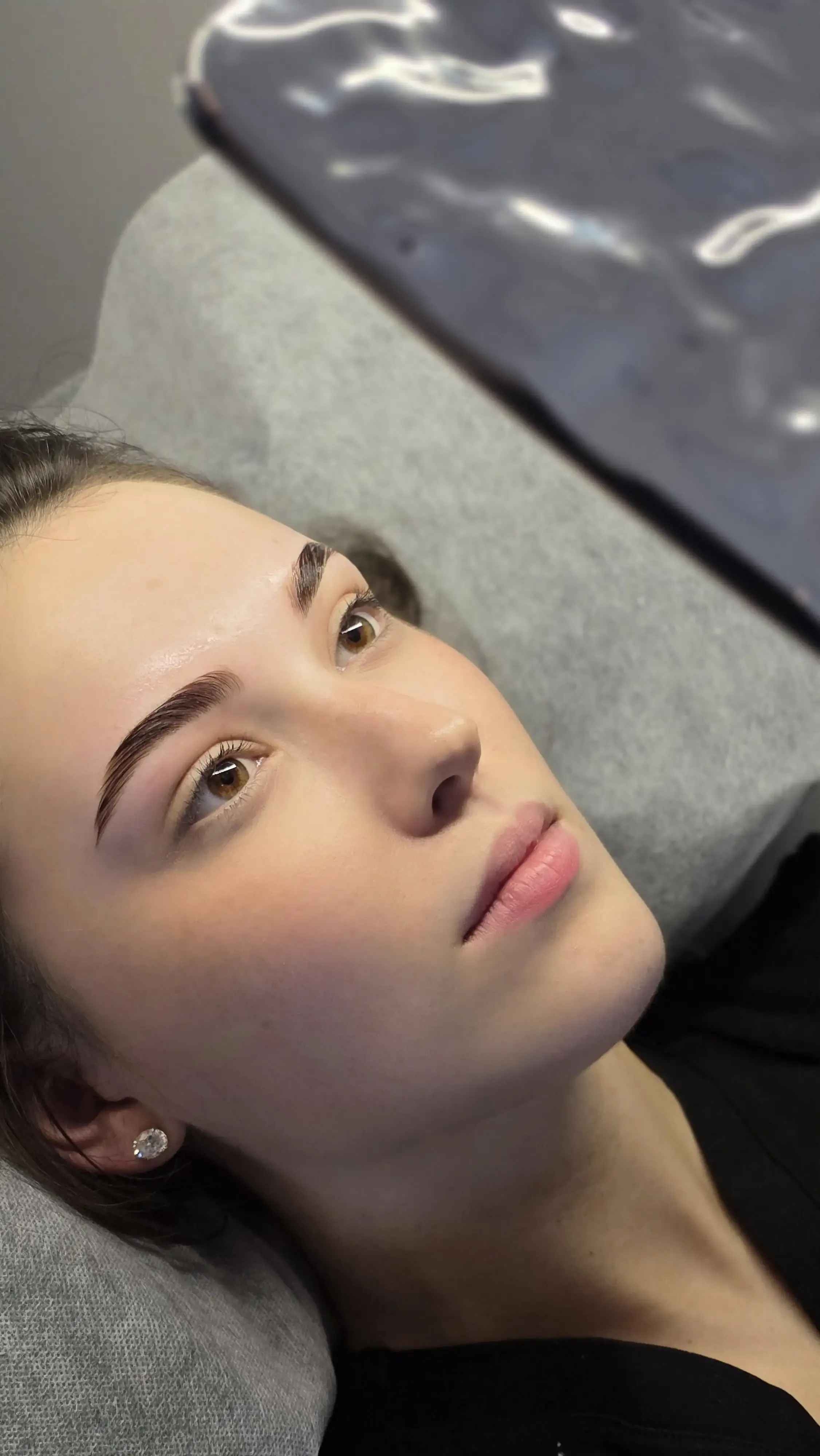 A finished sculpted brow on a client, shaped to the natural brow line
