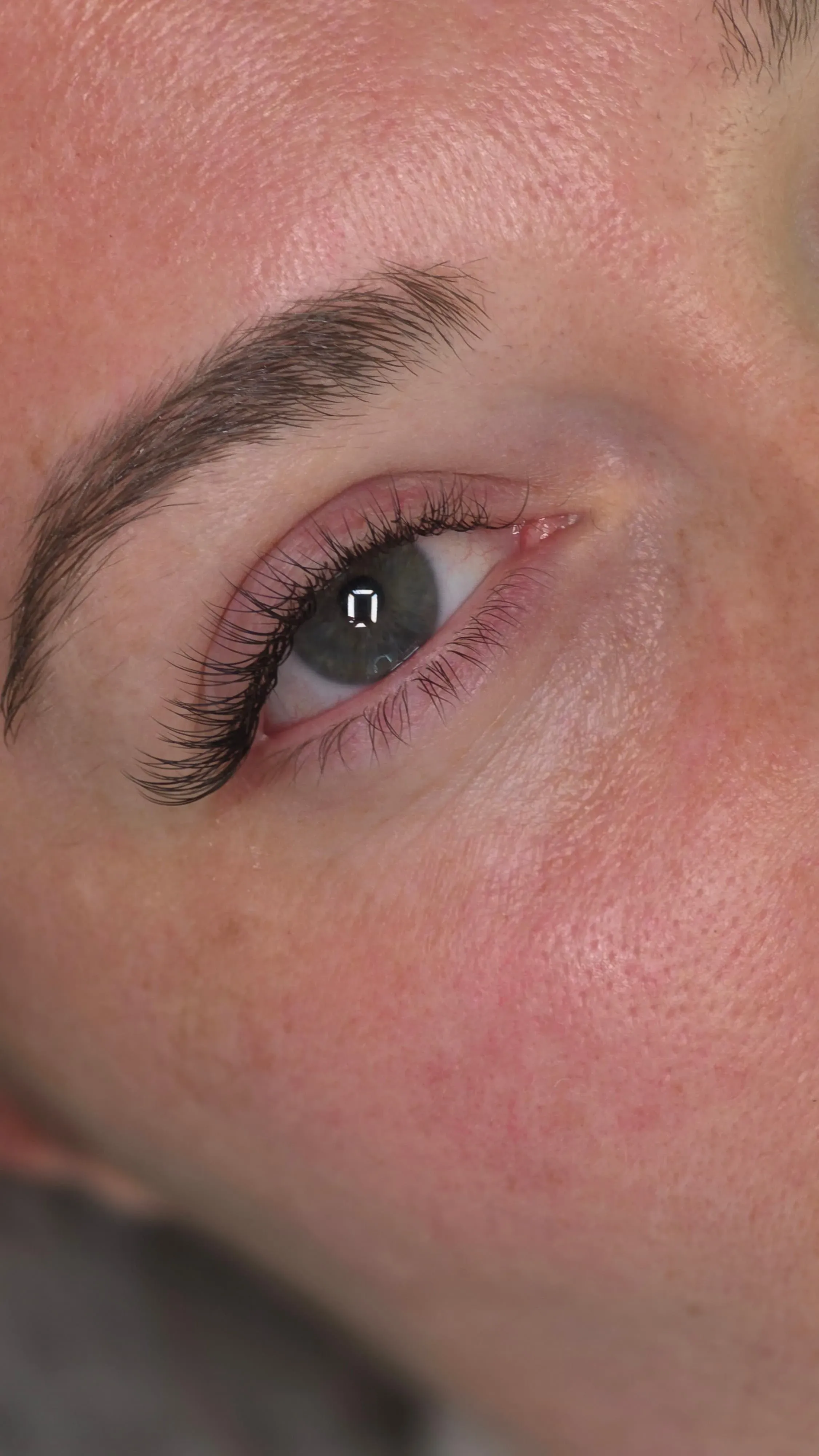 A finished lash lift on a client, lashes curled and separated